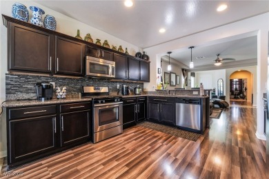 Paid-off solar panels and a prime corner lot with an expansive on Rhodes Ranch Golf Club in Nevada - for sale on GolfHomes.com, golf home, golf lot
