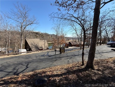 Welcome to your fully furnished lake retreat home featuring 4 on The Oaks Golf Course in Missouri - for sale on GolfHomes.com, golf home, golf lot