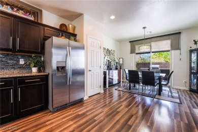 Paid-off solar panels and a prime corner lot with an expansive on Rhodes Ranch Golf Club in Nevada - for sale on GolfHomes.com, golf home, golf lot