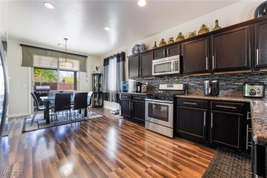 Paid-off solar panels and a prime corner lot with an expansive on Rhodes Ranch Golf Club in Nevada - for sale on GolfHomes.com, golf home, golf lot