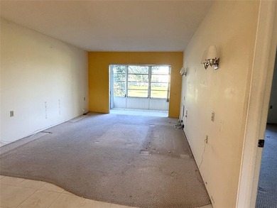 Discover the delightful charm of this distinctive property on Wynmoor Golf Course in Florida - for sale on GolfHomes.com, golf home, golf lot