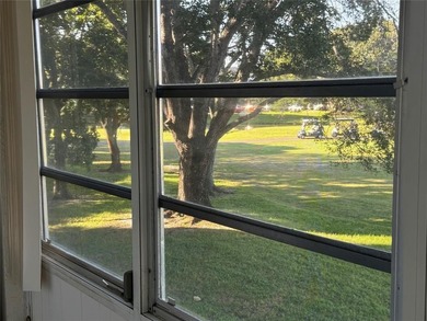 Discover the delightful charm of this distinctive property on Wynmoor Golf Course in Florida - for sale on GolfHomes.com, golf home, golf lot