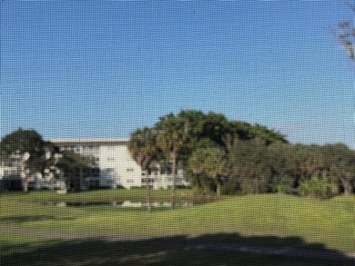 Discover the delightful charm of this distinctive property on Wynmoor Golf Course in Florida - for sale on GolfHomes.com, golf home, golf lot