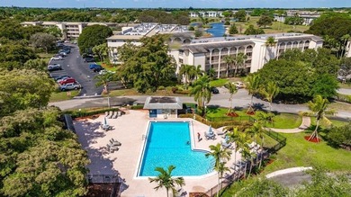 Discover the delightful charm of this distinctive property on Wynmoor Golf Course in Florida - for sale on GolfHomes.com, golf home, golf lot