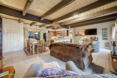 Step onto the spacious deck and take in breathtaking views of on Pinetop Lakes Golf and Country Club in Arizona - for sale on GolfHomes.com, golf home, golf lot