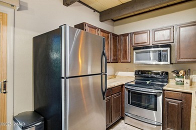 Step onto the spacious deck and take in breathtaking views of on Pinetop Lakes Golf and Country Club in Arizona - for sale on GolfHomes.com, golf home, golf lot