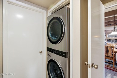 Step onto the spacious deck and take in breathtaking views of on Pinetop Lakes Golf and Country Club in Arizona - for sale on GolfHomes.com, golf home, golf lot