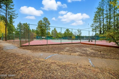 Step onto the spacious deck and take in breathtaking views of on Pinetop Lakes Golf and Country Club in Arizona - for sale on GolfHomes.com, golf home, golf lot