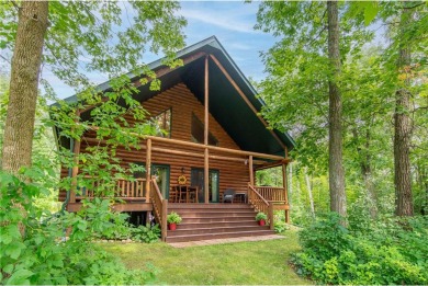 Discover the perfect blend of rustic charm and modern comfort in on Hardwoods Golf Club At Mille Lacs in Minnesota - for sale on GolfHomes.com, golf home, golf lot