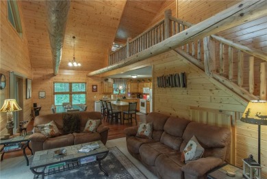 Discover the perfect blend of rustic charm and modern comfort in on Hardwoods Golf Club At Mille Lacs in Minnesota - for sale on GolfHomes.com, golf home, golf lot