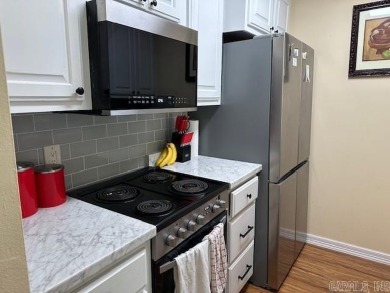 Discover the allure of modern living in this beautifully on Indian Hills Country Club in Arkansas - for sale on GolfHomes.com, golf home, golf lot