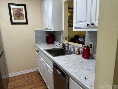 Discover the allure of modern living in this beautifully on Indian Hills Country Club in Arkansas - for sale on GolfHomes.com, golf home, golf lot