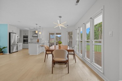 Nestled on a stunning HALF-ACRE corner lot directly on the on Myrtle Beach National Golf Course in South Carolina - for sale on GolfHomes.com, golf home, golf lot