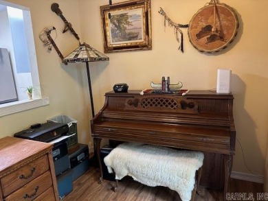 Discover the allure of modern living in this beautifully on Indian Hills Country Club in Arkansas - for sale on GolfHomes.com, golf home, golf lot