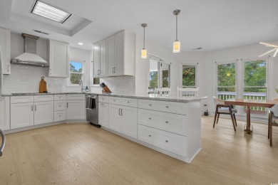 Nestled on a stunning HALF-ACRE corner lot directly on the on Myrtle Beach National Golf Course in South Carolina - for sale on GolfHomes.com, golf home, golf lot