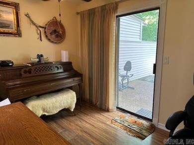 Discover the allure of modern living in this beautifully on Indian Hills Country Club in Arkansas - for sale on GolfHomes.com, golf home, golf lot