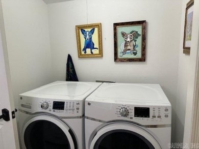 Discover the allure of modern living in this beautifully on Indian Hills Country Club in Arkansas - for sale on GolfHomes.com, golf home, golf lot