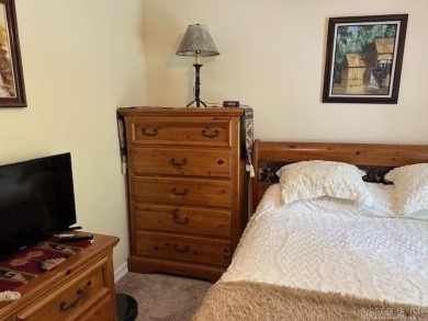 Discover the allure of modern living in this beautifully on Indian Hills Country Club in Arkansas - for sale on GolfHomes.com, golf home, golf lot