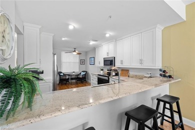 Enjoy breathtaking panoramic views of the serene lake and on Windstar on Naples Bay in Florida - for sale on GolfHomes.com, golf home, golf lot