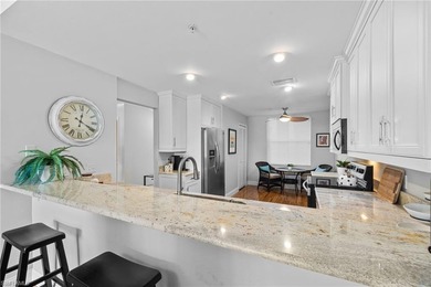 Enjoy breathtaking panoramic views of the serene lake and on Windstar on Naples Bay in Florida - for sale on GolfHomes.com, golf home, golf lot