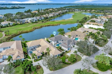 This stunning courtyard pool home with serene lake views has on Orchid Island Golf and Beach Club in Florida - for sale on GolfHomes.com, golf home, golf lot