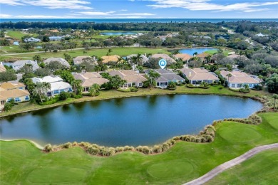 This stunning courtyard pool home with serene lake views has on Orchid Island Golf and Beach Club in Florida - for sale on GolfHomes.com, golf home, golf lot