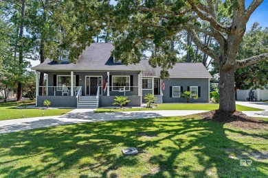Located in Wedgewood Estates, this Gulf Shores retreat with a on The Golf Club of the Wharf in Alabama - for sale on GolfHomes.com, golf home, golf lot