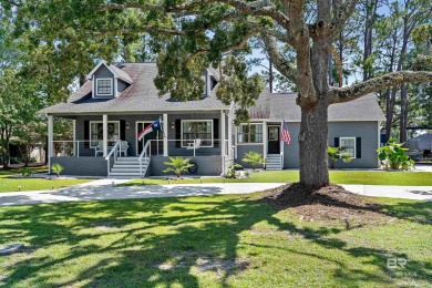 Located in Wedgewood Estates, this Gulf Shores retreat with a on The Golf Club of the Wharf in Alabama - for sale on GolfHomes.com, golf home, golf lot