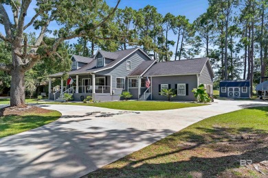 Located in Wedgewood Estates, this Gulf Shores retreat with a on The Golf Club of the Wharf in Alabama - for sale on GolfHomes.com, golf home, golf lot