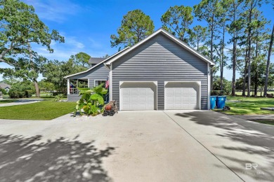 Located in Wedgewood Estates, this Gulf Shores retreat with a on The Golf Club of the Wharf in Alabama - for sale on GolfHomes.com, golf home, golf lot