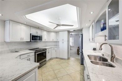 Sweeping golf course views and refined coastal elegance define on Bonita Bay West in Florida - for sale on GolfHomes.com, golf home, golf lot