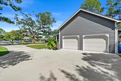 Located in Wedgewood Estates, this Gulf Shores retreat with a on The Golf Club of the Wharf in Alabama - for sale on GolfHomes.com, golf home, golf lot