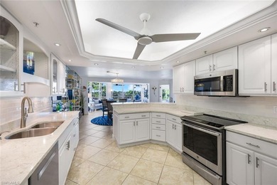 Sweeping golf course views and refined coastal elegance define on Bonita Bay West in Florida - for sale on GolfHomes.com, golf home, golf lot