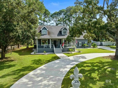 Located in Wedgewood Estates, this Gulf Shores retreat with a on The Golf Club of the Wharf in Alabama - for sale on GolfHomes.com, golf home, golf lot