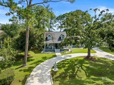 Located in Wedgewood Estates, this Gulf Shores retreat with a on The Golf Club of the Wharf in Alabama - for sale on GolfHomes.com, golf home, golf lot