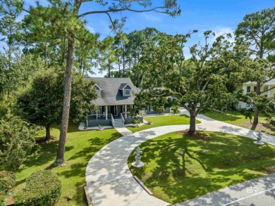 Located in Wedgewood Estates, this Gulf Shores retreat with a on The Golf Club of the Wharf in Alabama - for sale on GolfHomes.com, golf home, golf lot