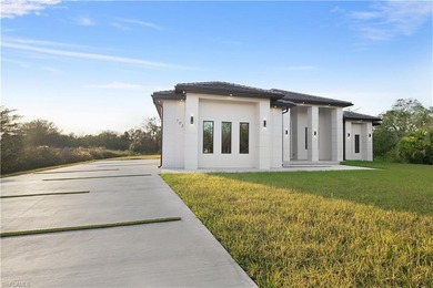 Welcome to 705 16th Street NE, a stunning contemporary on The Club At Twin Eagles in Florida - for sale on GolfHomes.com, golf home, golf lot