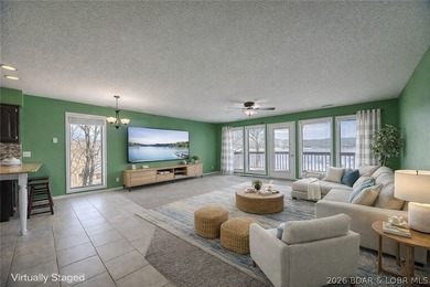 This isn't your typical lake condo-step inside and you'll feel on Lake Valley Country Club in Missouri - for sale on GolfHomes.com, golf home, golf lot