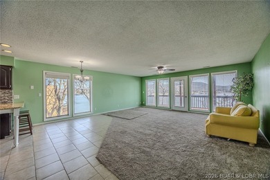 This isn't your typical lake condo-step inside and you'll feel on Lake Valley Country Club in Missouri - for sale on GolfHomes.com, golf home, golf lot