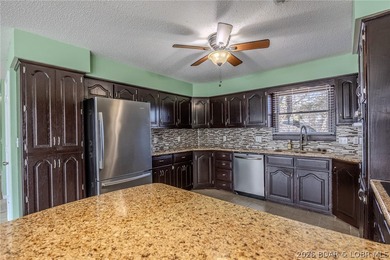 This isn't your typical lake condo-step inside and you'll feel on Lake Valley Country Club in Missouri - for sale on GolfHomes.com, golf home, golf lot