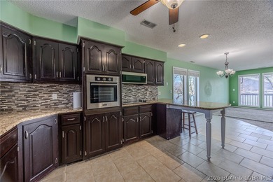 This isn't your typical lake condo-step inside and you'll feel on Lake Valley Country Club in Missouri - for sale on GolfHomes.com, golf home, golf lot