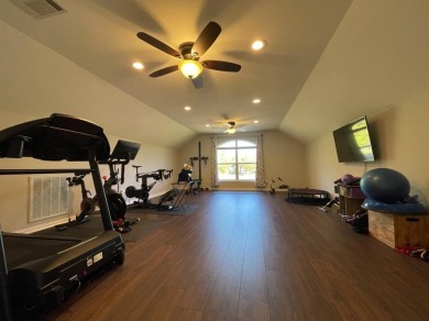 Discover this exquisitely spacious home nestled on a cul-desac on Pecan Plantation Country Club in Texas - for sale on GolfHomes.com, golf home, golf lot