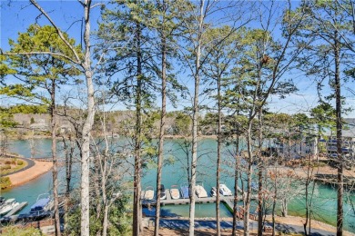 The Keowee Life awaits you! This waterfront, second-floor corner on Keowee Key Golf and Country Club in South Carolina - for sale on GolfHomes.com, golf home, golf lot