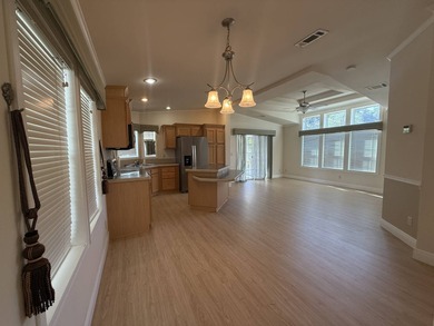 Spacious mobile home in a desirable and active community.  Step on Water Oak Country Club Estates in Florida - for sale on GolfHomes.com, golf home, golf lot