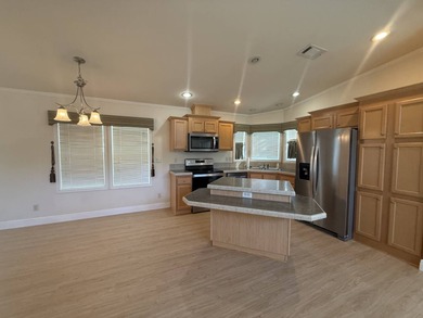 Spacious mobile home in a desirable and active community.  Step on Water Oak Country Club Estates in Florida - for sale on GolfHomes.com, golf home, golf lot