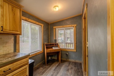 Location, location, location! Just 20 minutes from Yellowstone on Island Park Village Resort Golf Course in Idaho - for sale on GolfHomes.com, golf home, golf lot