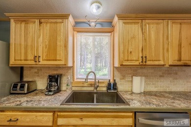 Location, location, location! Just 20 minutes from Yellowstone on Island Park Village Resort Golf Course in Idaho - for sale on GolfHomes.com, golf home, golf lot