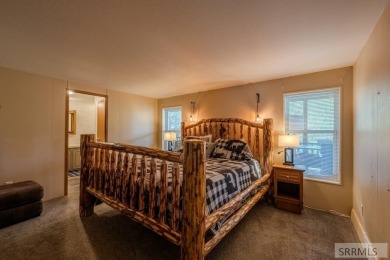 Location, location, location! Just 20 minutes from Yellowstone on Island Park Village Resort Golf Course in Idaho - for sale on GolfHomes.com, golf home, golf lot