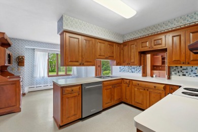This sprawling Cedar sided w/accents of Lannon stone Ranch is on Whitnall Park Golf Club in Wisconsin - for sale on GolfHomes.com, golf home, golf lot