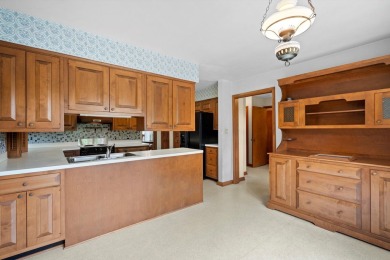 This sprawling Cedar sided w/accents of Lannon stone Ranch is on Whitnall Park Golf Club in Wisconsin - for sale on GolfHomes.com, golf home, golf lot